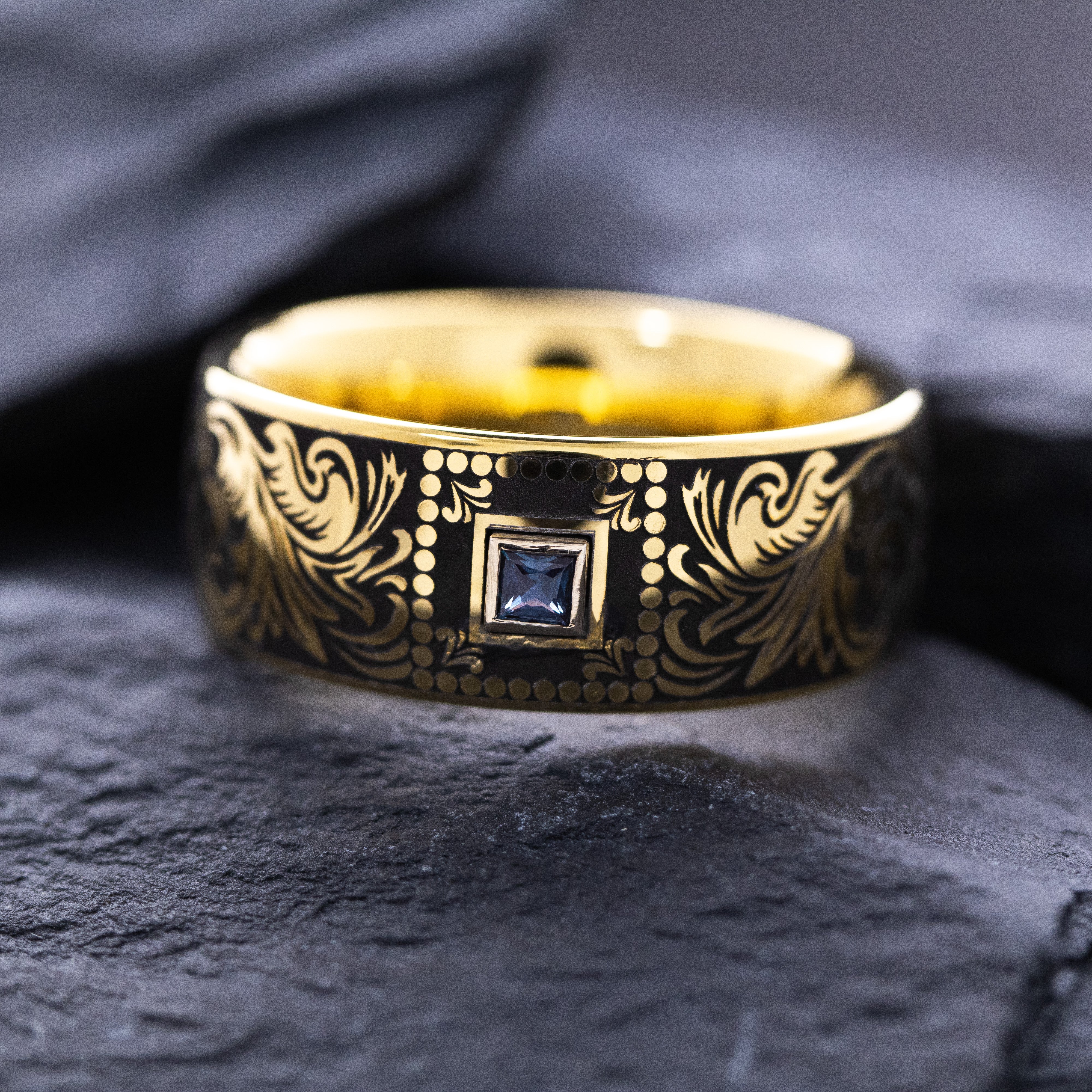8mm Custom Made Dome Shaped Yellow Gold Plated Tungsten with Victorian Inspired Engravings and a Square Shaped Sapphire