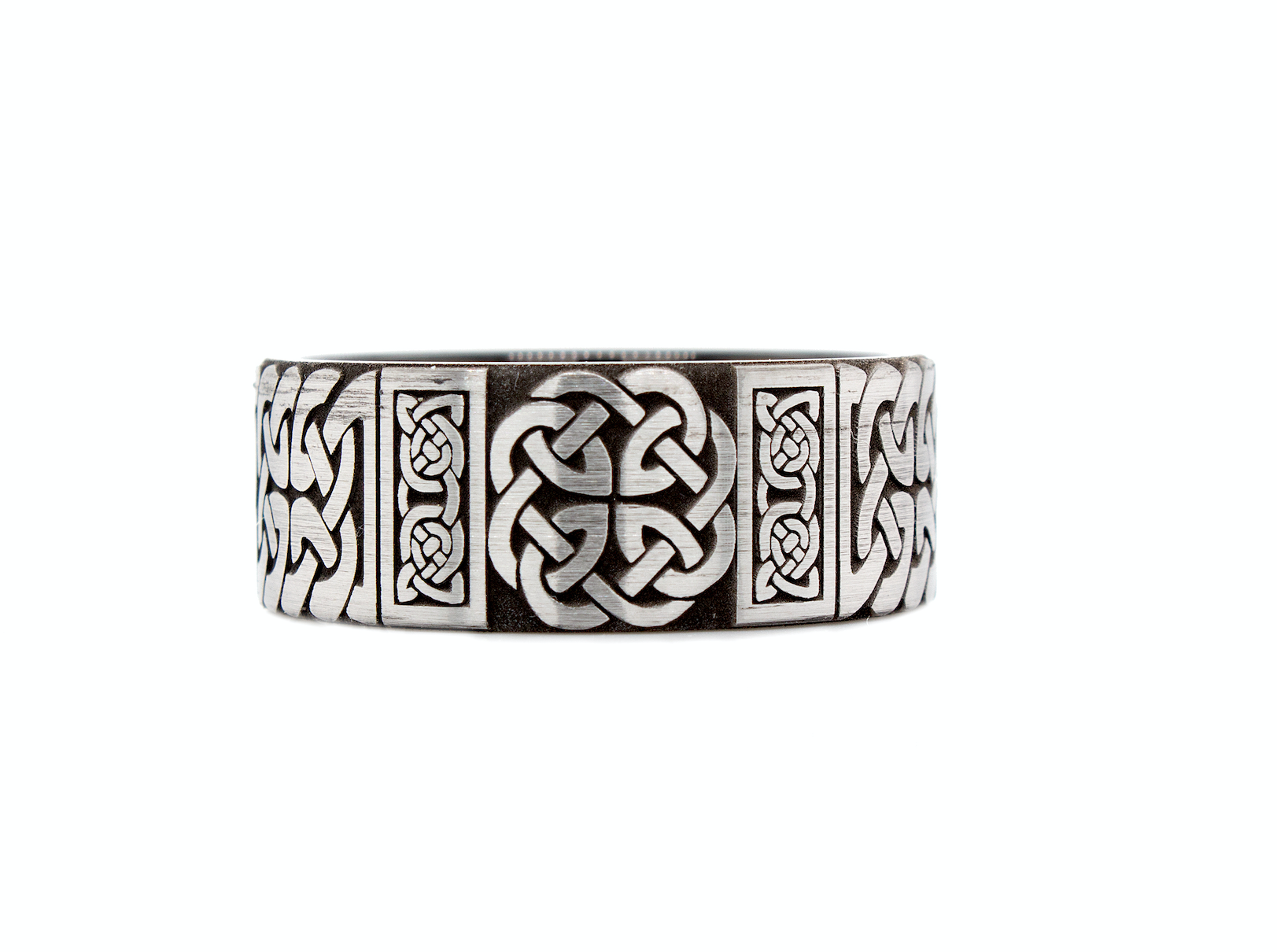 ring, ring with white backgrounds, tungsten wedding band, black plated tungsten, celtic knot engraving, celtic ring, celtic pattern, engraved ring, pipe cut ring