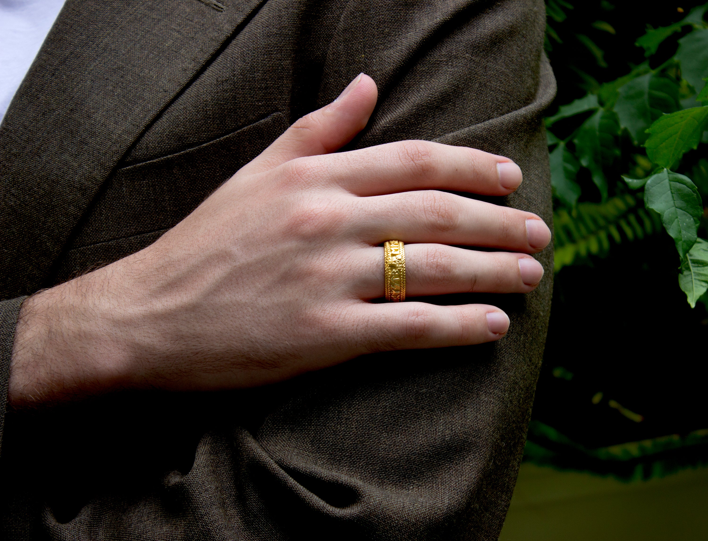 ring, ring on model, ring on hand, mens ring, womens ring, solid gold ring, yellow gold ring, wedding band, runes ring, runic ring, personalized ring, viking ring, nordic ring  Edit alt text