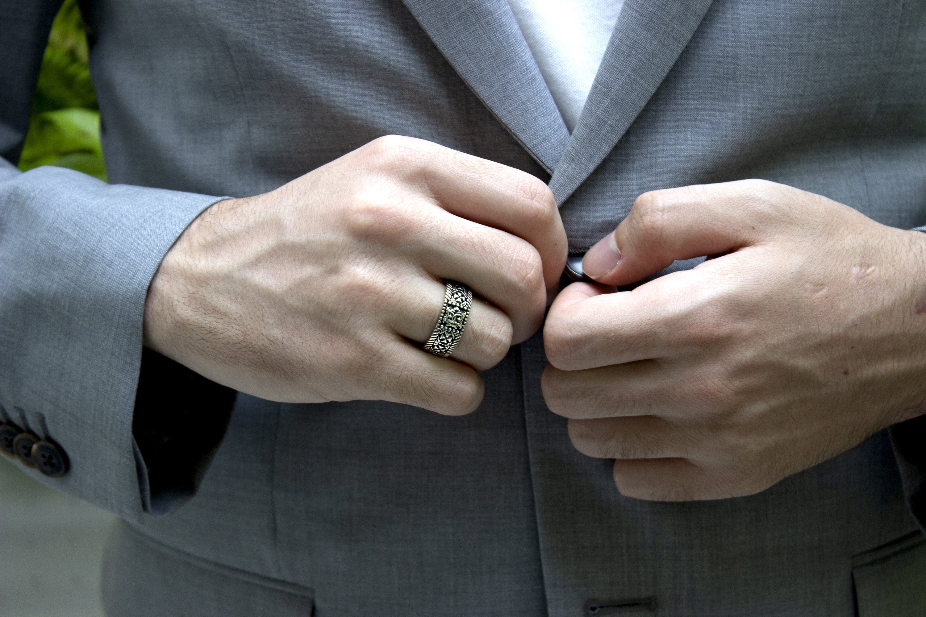 ring, model wearing ring, custom ring, custom wedding band, engraved ring, man wearing suit, posing, ring on hand, wedding band, custom wedding band, 8mm ring