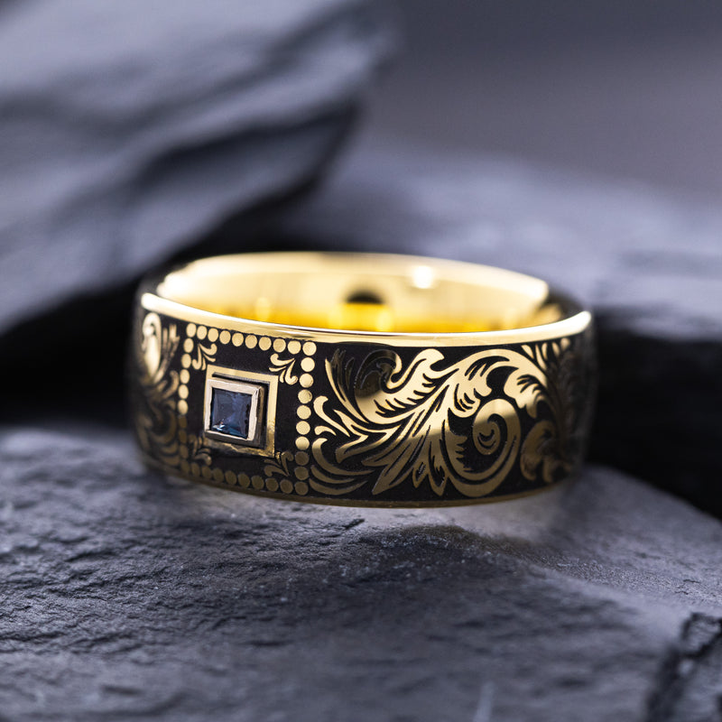 8mm Custom Made Dome Shaped Yellow Gold Plated Tungsten with Victorian Inspired Engravings and a Square Shaped Sapphire