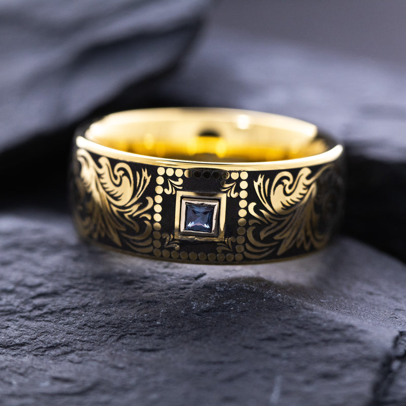 8mm Custom Made Dome Shaped Yellow Gold Plated Tungsten with Victorian Inspired Engravings and a Square Shaped Sapphire