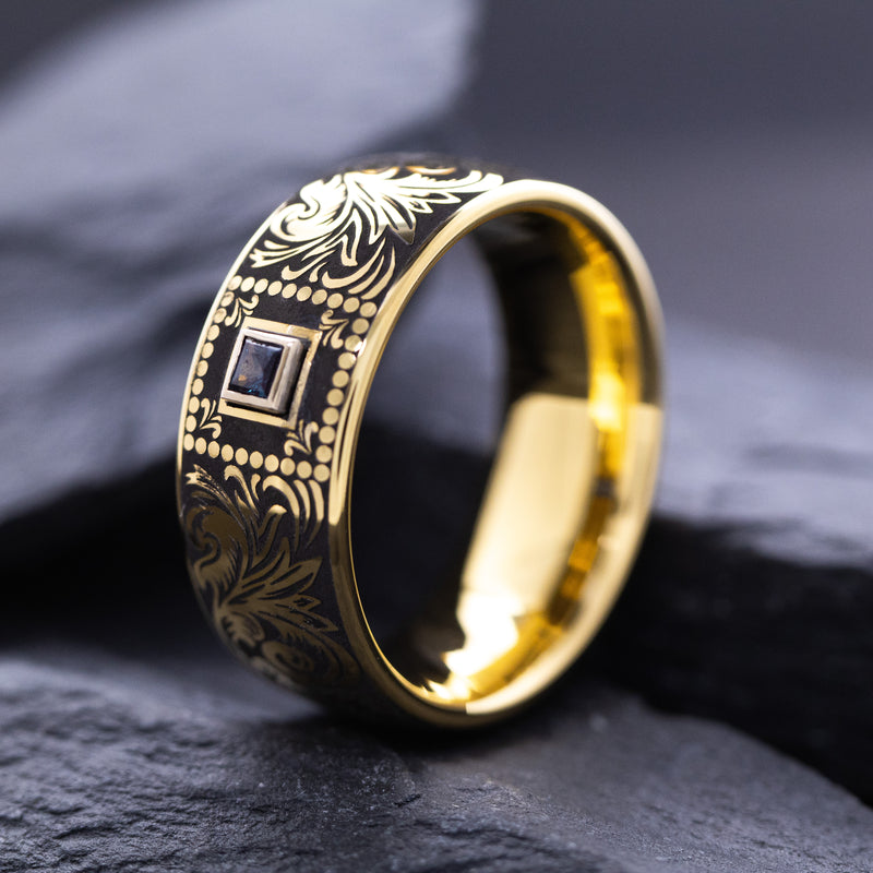 8mm Custom Made Dome Shaped Yellow Gold Plated Tungsten with Victorian Inspired Engravings and a Square Shaped Sapphire