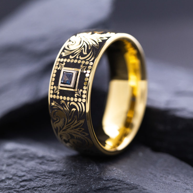 8mm Custom Made Dome Shaped Yellow Gold Plated Tungsten with Victorian Inspired Engravings and a Square Shaped Sapphire