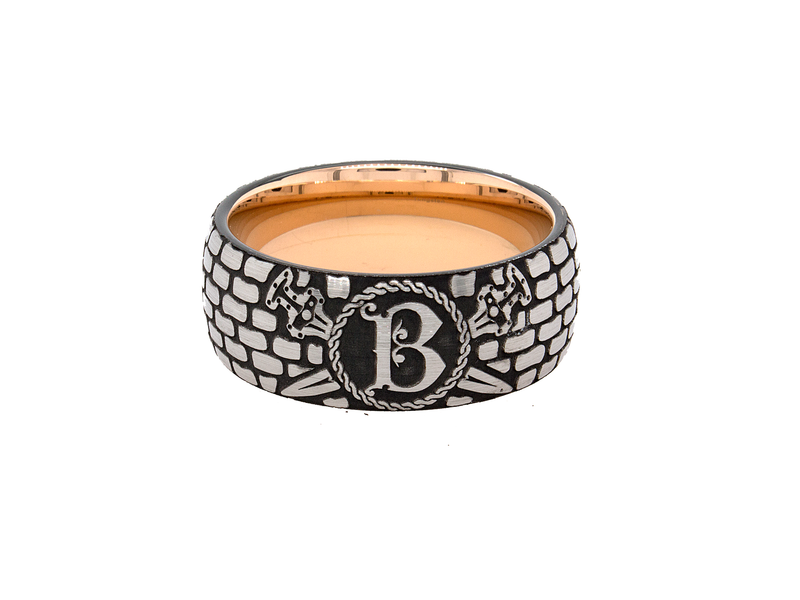 rin, ring on white background, ring with rose gold plating, ring with brick pattern, ring with initial, ring with letter g engraved, ring with ax engravings, viking inspired ring, viking ring, tungsten wedding band, mens wedding band, 9mm ring, women's wedding band, personalized wedding band, custom wedding band