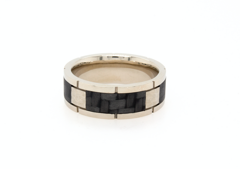 solid gold ring, ring on white background, gold ring, white gold wedding band, ring with carbon fiber, black carbon fiber inlay, square pattern ring, white gold wedding band, mens wedding band