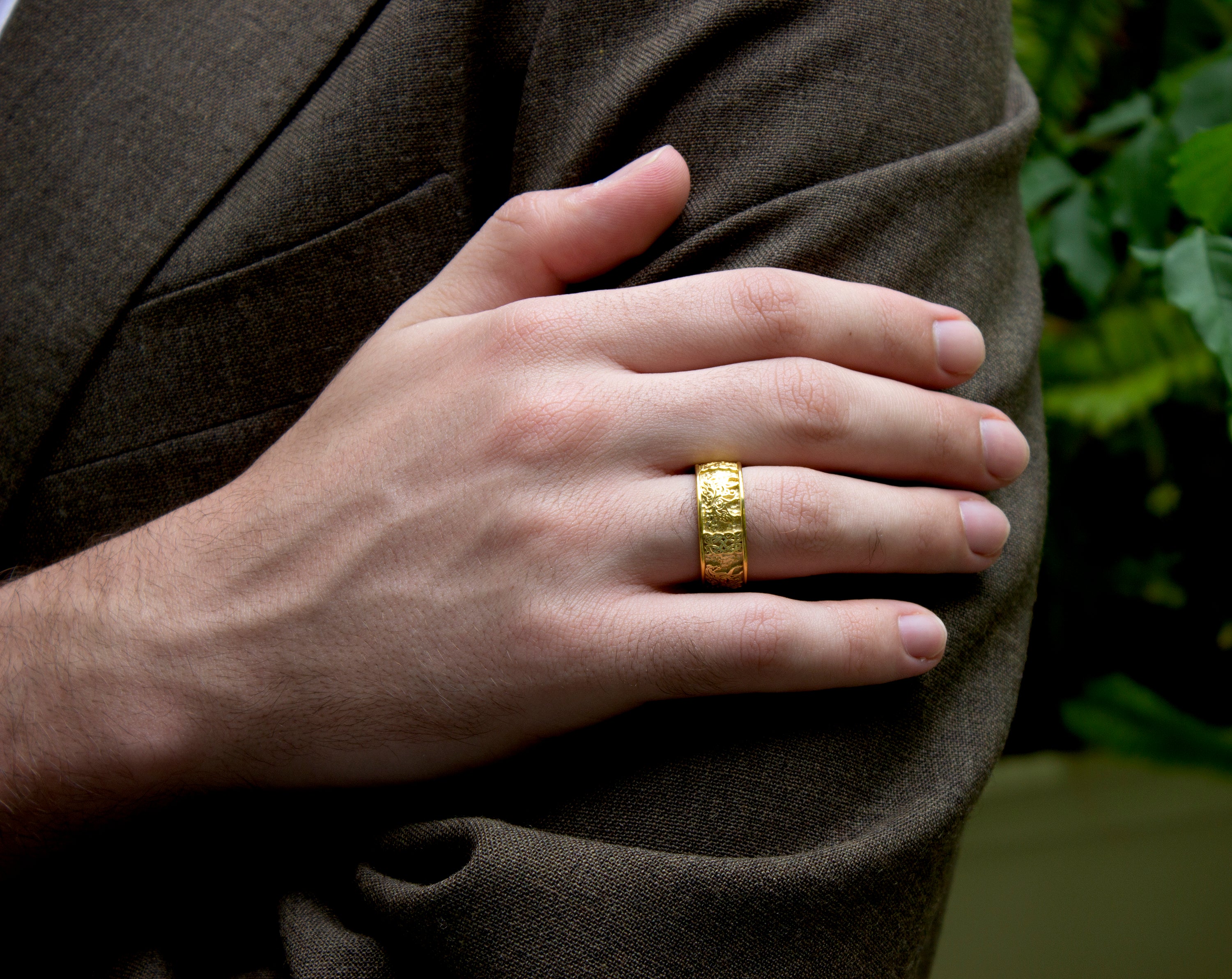 ring, ring on model, ring on finger, gold ring, solid gold ring, yellow gold ring, ring with celtic knots, celtic horses, celtic designs, engraving, mens ring, womens ring, unisex ring, wedding band, unique wedding band