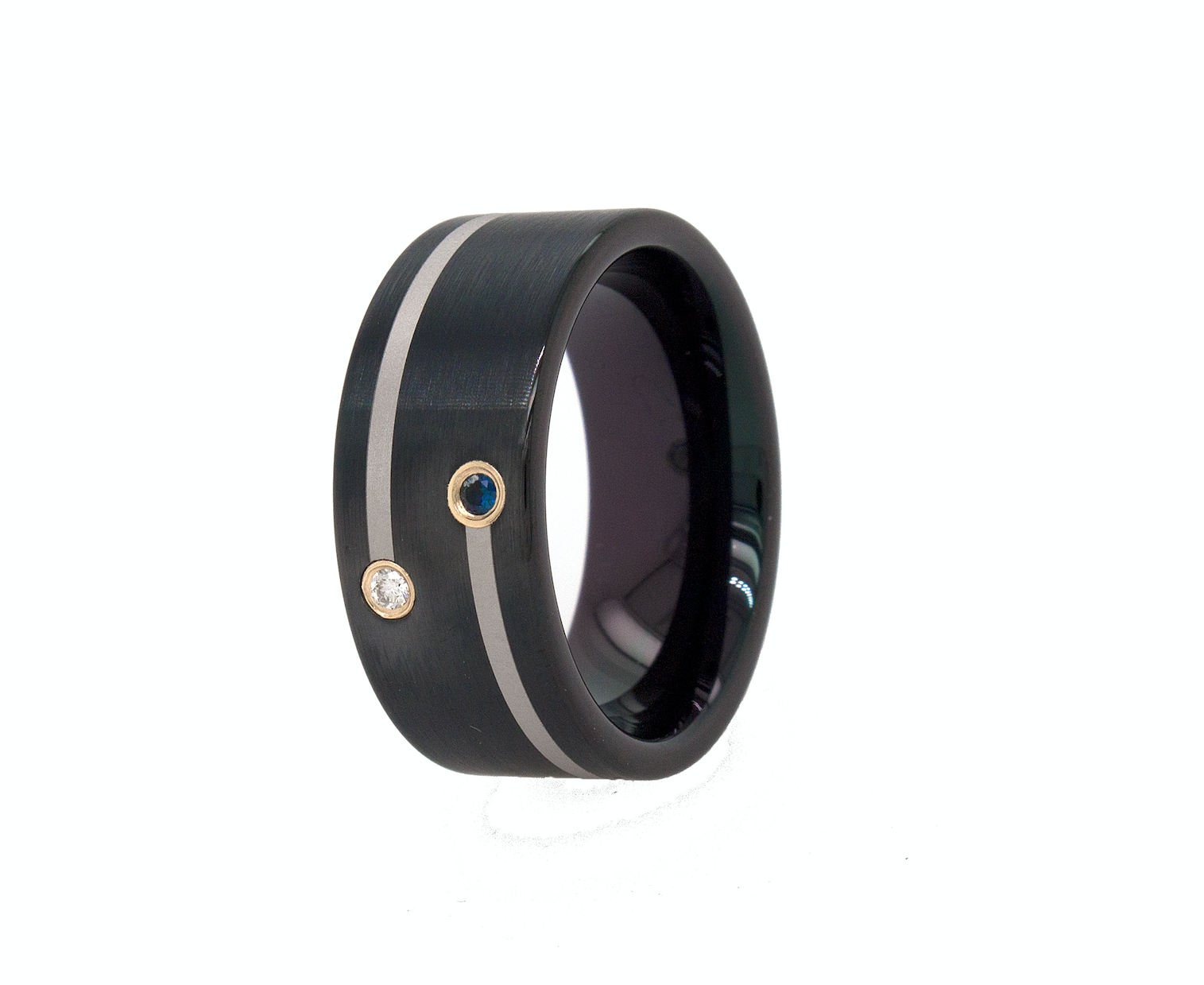 ring, ring on white background, black wedding band, black plated ring, ring with silver lines, ring with gemstones, gemstone ring, sapphire ring, diamond ring, wedding band for men, women's wedding band, personalized ring, personalized tungsten ring, pipe cut ring, black ring, brushed ring