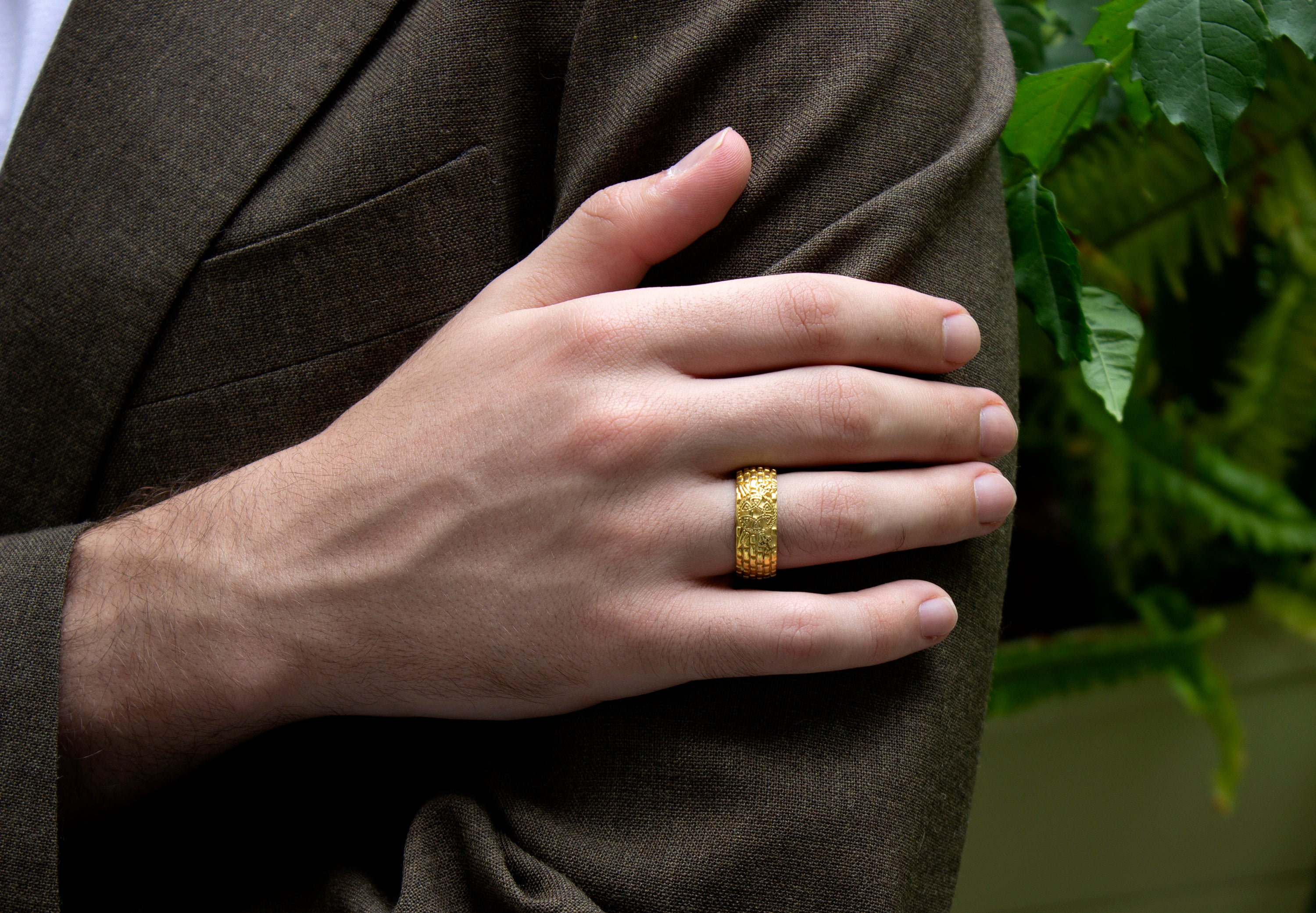 ring, ring on model, ring on hand, mens ring, women's ring, gold ring, solid gold ring, brick pattern ring, viking shield, swords, axes, yellow gold ring, mens ring, women's ring, 8mm ring, dome shaped ring