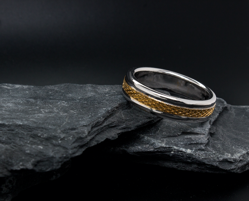 ring, ring on black background, solid gold ring, two-toned ring, white gold ring, yellow gold ring, cross hatch designs, pattern ring, texture ring, domed edges, wedding band, mens wedding band, womens wedding band