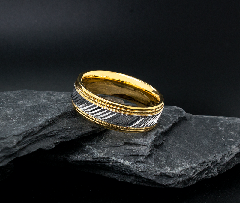 two toned ring, solid gold ring, white gold and yellow gold ring, grooved pattern, diagonal grooves, stepped edges, migrain engraving, polished ring, mens wedding band, womens wedding band, unisex ring, custom made ring, ring on rocks